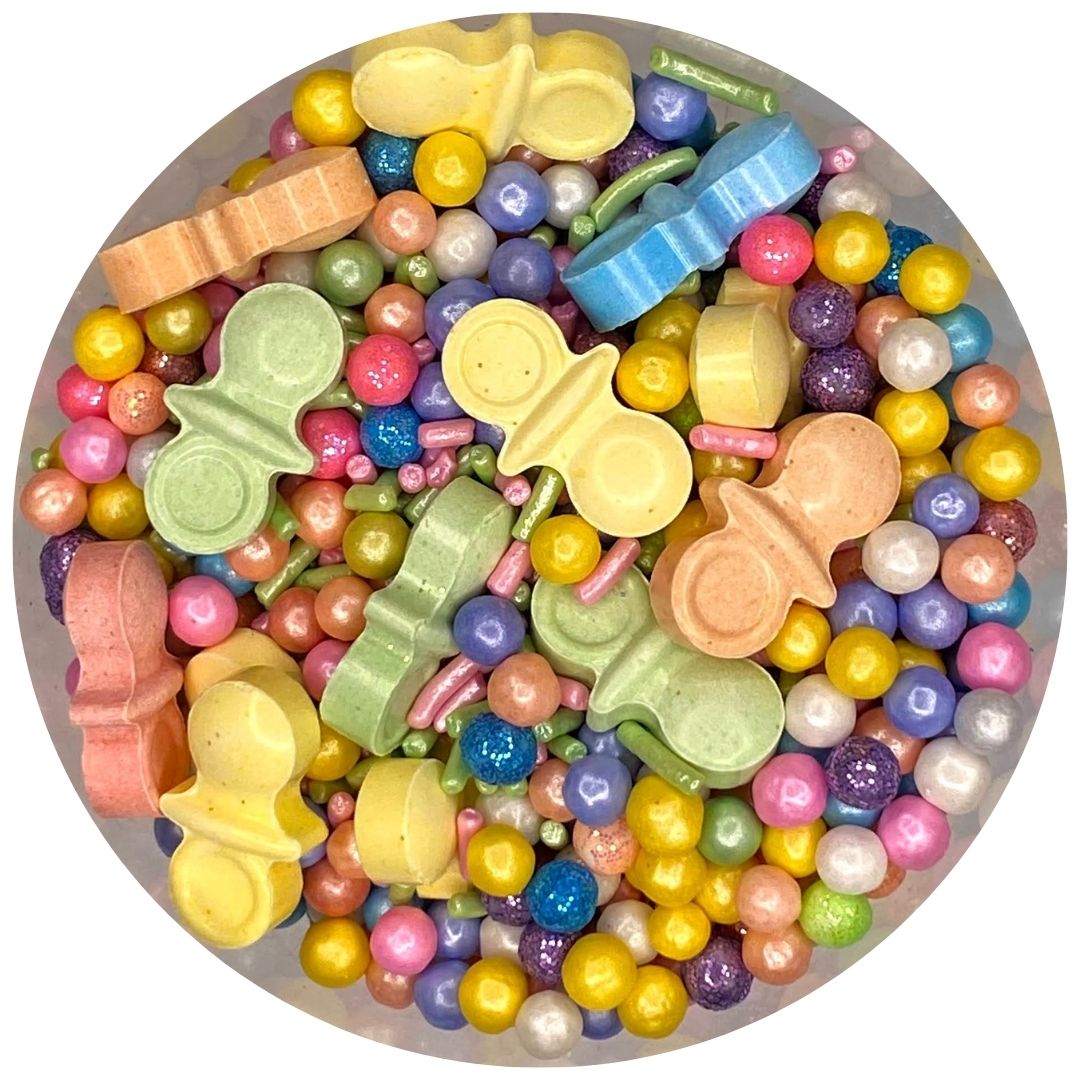 Mix de sprinkles con chupones baby shower